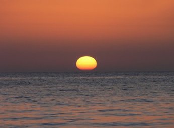 schiacciamento dovuto alla rifrazione atmosferica